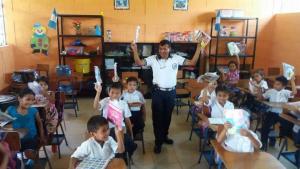Guatemala firefighters delivering school supplies - AMEDICAusa