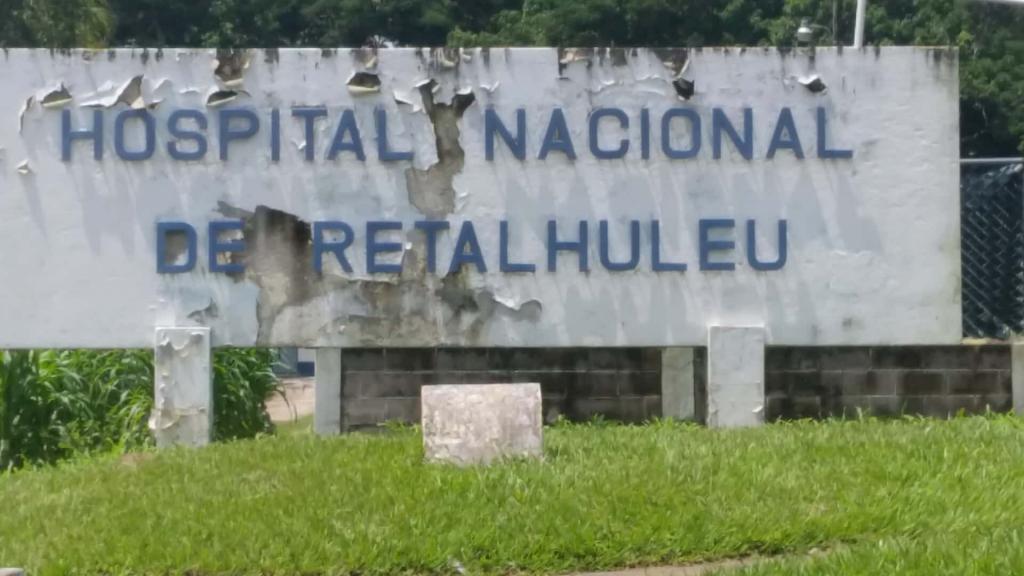 The Weather Worn Sign of the Hospital Nacional, Retalhuleu, Guatemala - AMEDICAusa