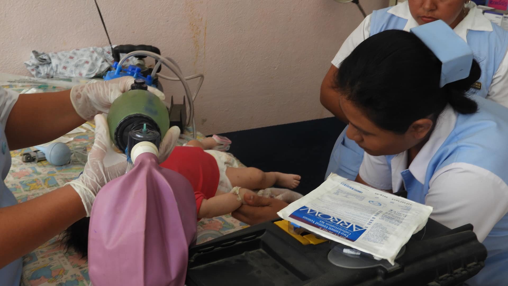 A child clings to life in the Pediatric Emergency Room at Hospital Nacional Retalhuleu