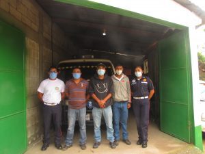 The five firefighters of E-119, Bomberos Municipales, San Carlos Alzatate, proudly standing in front of their "Frankenlance" 
